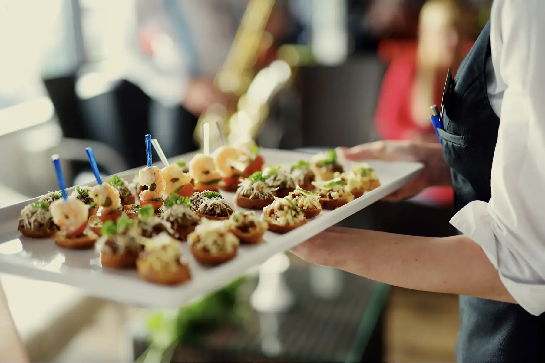 A tray of canapés carried through the Club at a drinks party